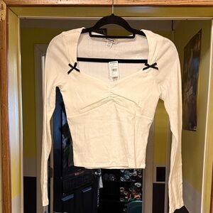 RSQ White Long Sleeve Top with Black Bow Accents